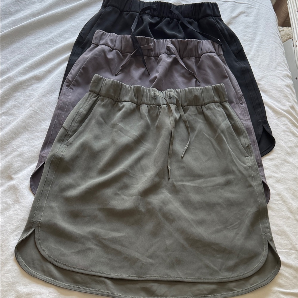 Pack of 3 Lululemon Women's skirts - Black, Green and Purple.